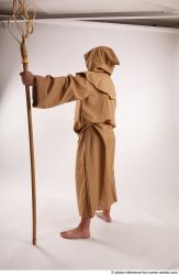 JOEL_ADAMSON STANDING POSE WITH A MAGIC STICK